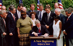 President Bill Clinton signing the Welfare Reform Act of 1996.